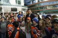 Edmonton Oilers hockey player Leon Draisaitl poses with students after helping to pack food hampers at the WE Scare Hunger youth rally held at Rogers Place in Edmonton on Tuesday, Nov. 5, 2019. Draisaitl donated $150,000 in support of WE in Alberta and Hockey Helps Kids. Truckloads of food were delivered to the Edmonton Food Bank after the event. More than 20,000 Edmontonians rely on the food bank on a monthly basis.