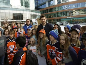Edmonton Oilers hockey player Leon Draisaitl poses with students after helping to pack food hampers at the WE Scare Hunger youth rally held at Rogers Place in Edmonton on Tuesday, Nov. 5, 2019. Draisaitl donated $150,000 in support of WE in Alberta and Hockey Helps Kids. Truckloads of food were delivered to the Edmonton Food Bank after the event. More than 20,000 Edmontonians rely on the food bank on a monthly basis.