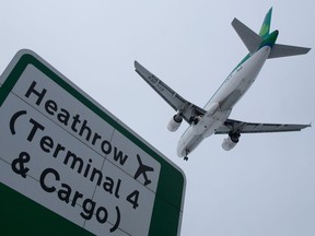 A plane flies in to land at Heathrow airport in west London. File photo.