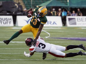 Edmonton Eskimos Ricky Collins Jr. eludes a tackle from Montreal Alouettes Patrick Levels during CFL game action in Edmonton on Friday June 14, 2019.