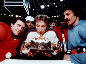 Edmonton Oilers centre Wayne Gretzky celebrates his 18th birthday in January 1979 at the Edmonton Coliseum with some of his teammates, including, from left, Dennis Sobchuk, Brett Callighen and Ed Walsh.