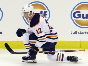 Edmonton Oilers center Colby Cave (12) reacts after scoring a goal against the Pittsburgh Penguins during the second period at PPG PAINTS Arena.