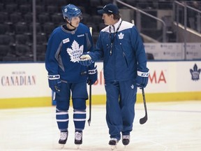 Mitch Marner and former Leafs coach Mike Babcock talk during practice in 2017. JACK BOLAND/TORONTO SUN