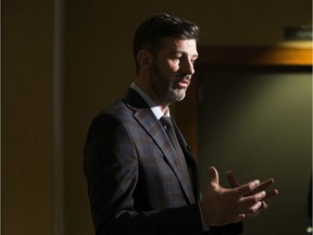Mayor Don Iveson talks to the media after speaking at the National Housing Day luncheon on Friday, Nov. 22, 2019 in Edmonton.