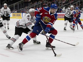 Edmonton Oil Kings' Vladimir Alistrov (10) battles the Red Deer Rebels' Joel Sexsmith (7) during first period WHL action at Rogers Place, in Edmonton Sunday Sept. 22, 2019.