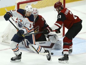 CP-Web. Edmonton Oilers left wing Joakim Nygard (10) tries to redirect the puck as Arizona Coyotes defenseman Oliver Ekman-Larsson (23) and Coyotes goaltender Darcy Kuemper, center, protect the net during the first period of an NHL hockey game Sunday, Nov. 24, 2019, in Glendale, Ariz.