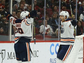 Edmonton Oilers right wing Alex Chiasson, right, celebrates his goal against the Arizona Coyotes with center Sam Gagner (89) during the second period of an NHL hockey game Sunday, Nov. 24, 2019, in Glendale, Ariz.