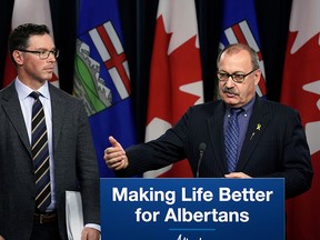 Alberta Justice Minister Doug Schweitzer, left, and Alberta Transportation Minister Ric McIver provide an update on photo radar in Alberta at the legislature in Edmonton on Tuesday, Nov. 26, 2019.