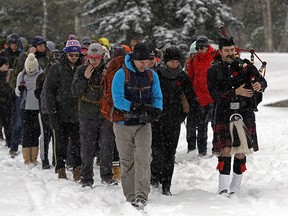 Participants begin the Rucksack March for Remembrance from Goldbar Park in Edmonton on Saturday November 9, 2019. The 22 kilometer march through Edmonton's river valley, with particip[ants carrying a 22 kilogram rucksack on their backs, took about five hours to complete. The goal of the march was to raise $10,000 to support Wounded Warriors Canada, which provides mental health programming to veterans, first responders and correctional officers. (PHOTO BY LARRY WONG/POSTMEDIA)