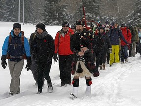 Bagpiper Jean Michel Tetrault leads participants at the start of the Rucksack March for Remembrance from Goldbar Park in Edmonton on Saturday, Nov. 9, 2019. The 22-km march through Edmonton's river valley, with participants carrying a 22-kilogram rucksack on their backs, took about five hours to complete. The goal of the march was to raise $10,000 to support Wounded Warriors Canada, which provides mental health programming to veterans, first responders and correctional officers.