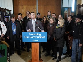 Doug Schweitzer (at podium, Alberta Minister of Justice and Solicitor General) announced the government’s initial plan to combat rural crime in Alberta on Wednesday November 6, 2019. The announcement was made at a private ranch in Wetaskiwin County. (PHOTO BY LARRY WONG/POSTMEDIA)