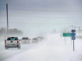 In Mason City, Iowa, motorists navigate an ice and snow-covered road on November 27, 2019, one of the busiest travel days of the year.