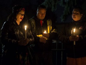 Robin Buglar (left) attends a candle light vigil for her sister Rebecca Hunter, in Edmonton Wednesday Nov. 20, 2019. Photo by David Bloom