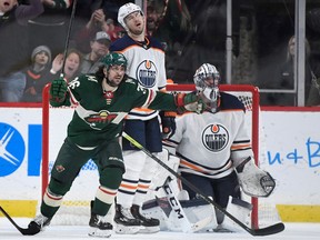 ST PAUL, MINNESOTA - DECEMBER 12: Mats Zuccarello #36 of the Minnesota Wild celebrates a goal by teammate Eric Staal (not pictured as Oscar Klefbom #77 and goaltender Mike Smith #41 of the Edmonton Oilers look on during the third period of the game at Xcel Energy Center on December 12, 2019 in St Paul, Minnesota. The Wild defeated the Oilers 6-5.