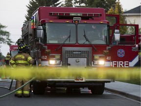 An Edmonton Fire Rescue Services crew at work on a residential fire.