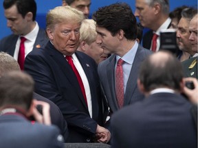 HERTFORD, ENGLAND - DECEMBER 04: U.S. President Donald Trump (L) ad Canadian Prime Minister Justin Trudeau (R) attend the NATO summit at the Grove Hotel on December 4, 2019 in Watford, England.