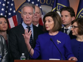 WASHINGTON, DC - DECEMBER 10: U.S. House Speaker Nancy Pelosi (D-CA) and Ways and Means Committee Chairman Richard E. Neal (D-MA) (L), speak during a news conference on the USMCA trade agreement, on Capitol Hill December 10, 2019 in Washington, DC.