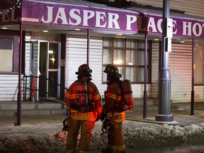 Fire fighters work at the scene of a fire at the Jasper Place Hotel, 15326 Stony Plain Rd., in Edmonton Monday Dec. 23, 2019. Photo by David Bloom