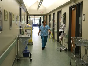 A nurse walks down a hallway at the Slave Lake Healthcare Centre in Slave Lake, Alberta on June 16, 2017.