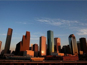 A view of the Houston skyline at dusk is seen in this 2013 file photo. Houston, while much larger than Calgary, has some similar economic challenges at the moment.