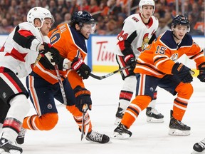 Edmonton Oilers' James Neal (18) battles Ottawa Senators' Mark Borowiecki (74) during the second period of a NHL hockey game at Rogers Place in Edmonton, on Wednesday, Dec. 4, 2019. Photo by Ian Kucerak/Postmedia