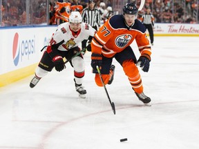 Edmonton Oilers' Oscar Klefbom (77) battles Ottawa Senators' Vladislav Namestnikov (90) during the third period of a NHL hockey game at Rogers Place in Edmonton, on Wednesday, Dec. 4, 2019. Photo by Ian Kucerak/Postmedia