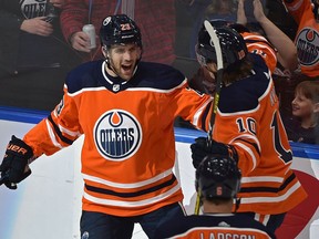 Edmonton Oilers Riley Sheahan (23) scores his first goal as an Oiler, celebrates with Joakim Nygard (10) and Adam Larsson (6) against the Buffalo Sabres during NHL action at Rogers Place in Edmonton, December 8, 2019.