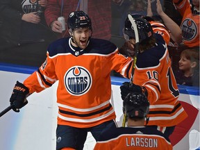 Edmonton Oilers Riley Sheahan (23) scores his first goal as an Oiler, celebrates with Joakim Nygard (10) and Adam Larsson (6) against the Buffalo Sabres during NHL action at Rogers Place in Edmonton, December 8, 2019. Ed Kaiser/Postmedia