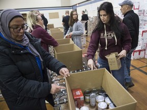 About 40 volunteers packed 1,300 hampers, on Thursday, Dec. 12, 2019, for the Christmas Bureau in the gym of St. Francis of Assisi Elementary School for delivery to families in need.