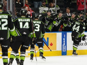 Edmonton Oil Kings' Carter Souch (44) celebrates a goal with teammates on Swift Current Broncos' goaltender Isaac Poulter during second period WHL hockey action at Rogers Place in Edmonton, on Friday, Dec. 13, 2019. Photo by Ian Kucerak/Postmedia