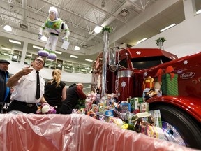 The Salvation Army's Maj. Al Hoeft pitches in to sort and box approximately 1,600 toys with other volunteers and staff as the Salvation Army collected the results of Stahl Peterbilt's Santa's Glider Toy Drive for The Salvation Army at the dealership in Edmonton on Monday, Dec. 16, 2019.