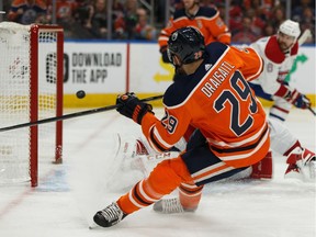 Edmonton Oilers' Leon Draisaitl (29) scores on Montreal Canadiens' goaltender Carey Price (31) during first period NHL hockey action at Rogers Place in Edmonton, on Saturday, Dec. 21, 2019.