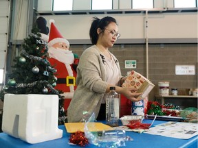 Jana Lee, Education Programs Supervisor with the City of Edmonton, explains how to properly sort holiday waste during a press conference at Ambleside Eco Station in Edmonton, on Friday, Dec. 27, 2019.
