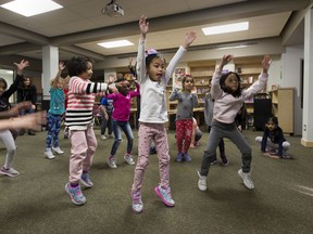 Grade two students at Our Lady of Peace School do frog jumps. Workers wanted tools to teach students how to regulate their emotions, but found, they didn't have a toolkit they could easily distribute to school staff - so they made their own called the FOCUS tool.