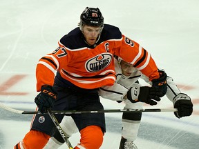 Edmonton Oilers captain Connor McDavid eludes a check from Los Angeles Kings Matt Roy during NHL game action in Edmonton on Saturday October 5, 2019. (PHOTO BY LARRY WONG/EDMONTON JOURNAL)