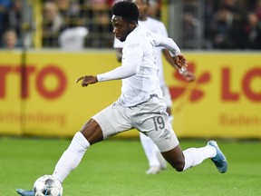 Bayern Munich's Canadian midfielder Alphonso Davies controls the ball during the German first division Bundesliga football match against SC Freiburg on December 18, 2019 in Freiburg, Germany.