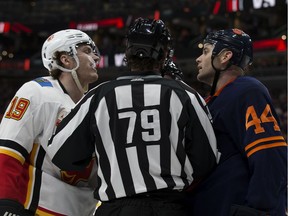 The Edmonton Oilers' Zack Kassian (44) has words with the Calgary Flames' Matthew Tkachuk (19) during first period NHL action at Rogers Place, in Edmonton Friday Dec. 27, 2019.