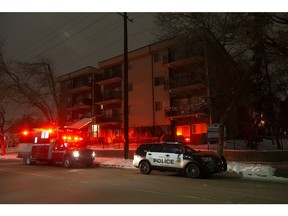 Fire Investigators and police respond to an incident at an apartment building near 65 Street and 129 Avenue, in Edmonton Tuesday Dec. 24, 2019. Photo by David Bloom