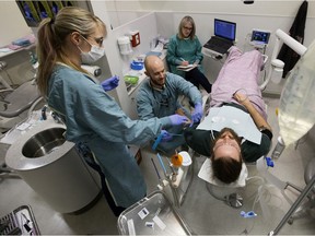 Dr. Don Beeson (from Grande Prairie) works on patient Charles Harker during the U of A School of Dentistry's IV conscious sedation course at the Kaye Edmonton Clinic, 11400 University Ave, in Edmonton Thursday Dec. 19, 2019. Over 80 patients took part in the course which provided approximately 140 treatments free of charge.