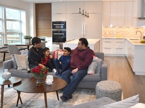 Tricia and Robert Joseph, with their children Cecily, 6, Emmanuel, 7, inside their new infill home by Habitat Studio in Parkallen.