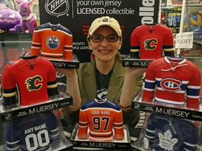 Janet Deane is an Edmonton artist and NHL licensee with new limited edition mini team jersey sculptures on sale at West Edmonton Coin and Stamp in West Edmonton Mall. (PHOTO BY LARRY WONG/POSTMEDIA)