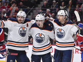 Ryan Nugent-Hopkins #93 of the Edmonton Oilers (C) celebrates a goal with teammates Leon Draisaitl #29 (L) and Alex Chiasson #39 (R) during the third period against the Montreal Canadiens at the Bell Centre on January 9, 2020 in Montreal.