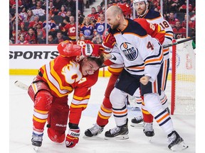 Zack Kassian #44 of the Edmonton Oilers fights Matthew Tkachuk #19 of the Calgary Flames during an NHL game at Scotiabank Saddledome on January 11, 2020 in Calgary, Alberta, Canada.