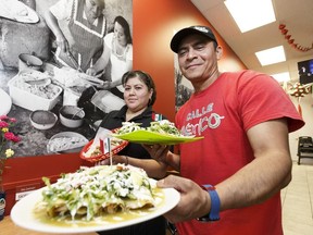 Owners Angelica Del Carmen and Juan Talango pose for a photo in their restaurant, Calle Mexico, which recently opened up a third location at 7704 104 St.