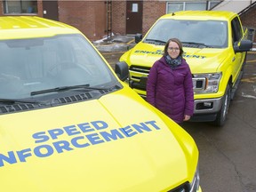 Jessica Lamarre, Acting Director for Traffic Safety, with two of the mobile photo radar trucks that will get a bright wrap to make them more visible to motorists on December 2, 2019.  Photo by Shaughn Butts / Postmedia