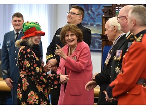 The Lieutenant Governor of Alberta Lois Mitchell points out Linda Swyck's homemade Christmas/New Year's Day hat, as she greets her while hosting the annual New Year's Day Levee, an open house-style event, at Government House in Edmonton, January 1, 2020. Ed Kaiser/Postmedia