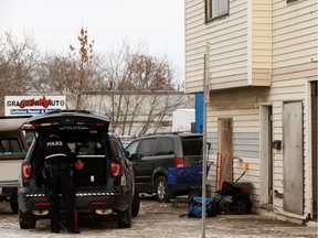 An Edmonton Police Service officer works at a stabbing scene at 12103 66 Street in Edmonton, on Friday, Jan. 3, 2020.
