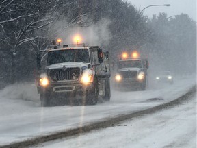 Snowplows clearing 40 Avenue from the accumualted snow near Whitemud Drive Wednesday, Jan. 8, 2020.