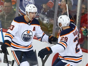 Oilers Ryan Nugent-Hopkins (L) and Leon Draisaitl celebrate the team's first goal of the game during NHL action between the Edmonton Oilers and the Calgary Flames in Calgary on Saturday, January 11, 2020.
