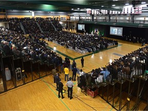 At least 2,300 people gather at a public memorial service to remember victims of last week's air crash outside Tehran, Iran, at the Saville Community Sports Centre in Edmonton on Sunday, Jan. 12, 2020.